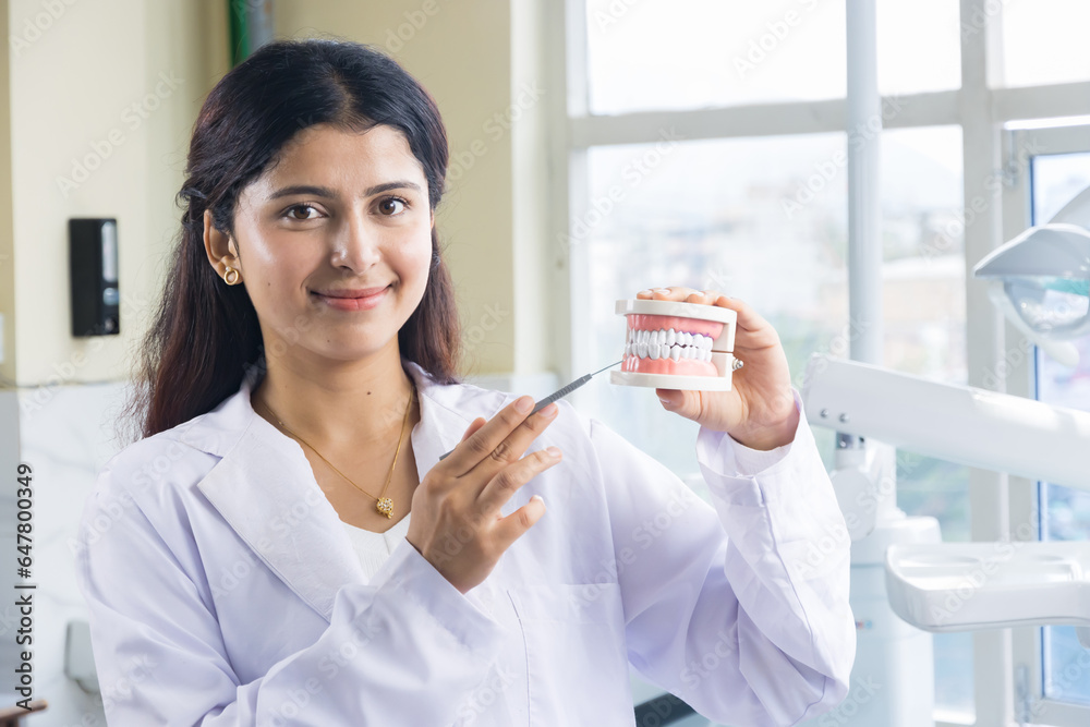Beautiful Indian Looking Nepali Dentist Doctor Girl Smiling and Giving gestures