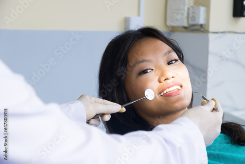Smiling Asian Patient in a Dentist Office in Kathmandu, Nepal