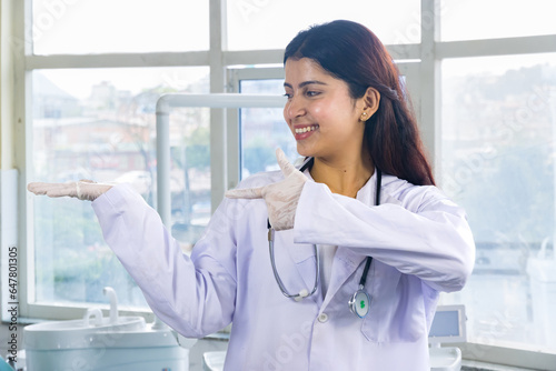 Beautiful Indian Looking Nepali Dentist Doctor Girl Smiling and Giving gestures