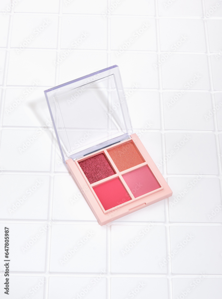 A palette of beautiful and delicate colors shadows with a mirror. Make up and cosmetics. A palette of beautiful and delicate colors shadows with a mirror. Make up and cosmetics.