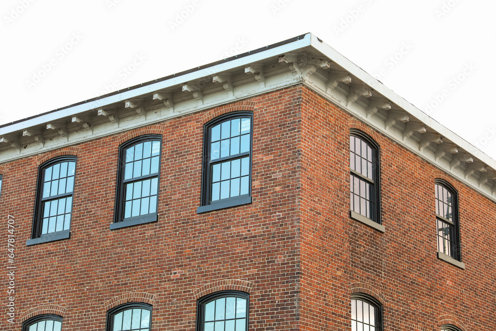 brick building with arched windows, symbolizing stability and growth in the business and mortgage industry, a hub of commerce brick building with arched windows, symbolizing stability and growth in the business and mortgage industry, a hub of commerce