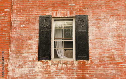 brick building with arched windows  symbolizing stability and growth in the business and mortgage industry  a hub of commerce