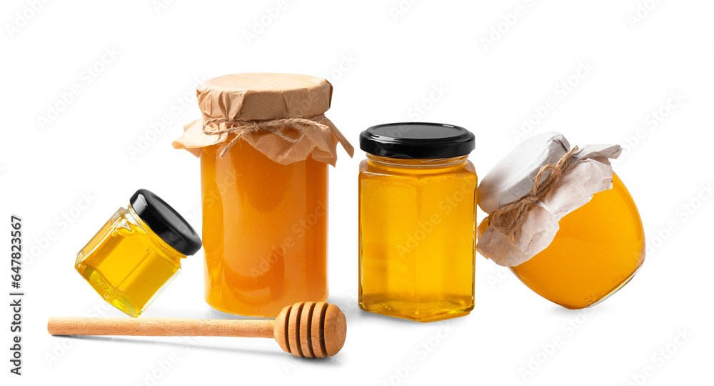 Banks with honey one near the other on a white background. Banks with honey one near the other on a white background.