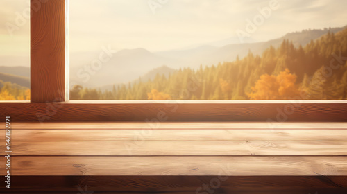 Empty wooden rustic window sill. Outside the window are trees, an autumn forest. Cozy template for displaying products. 