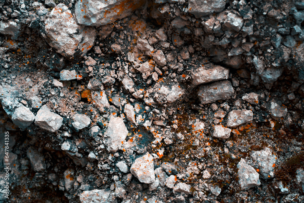 Textured rock, white and gray stones with orange moss in the mountains. Textured rock, white and gray stones with orange moss in the mountains.