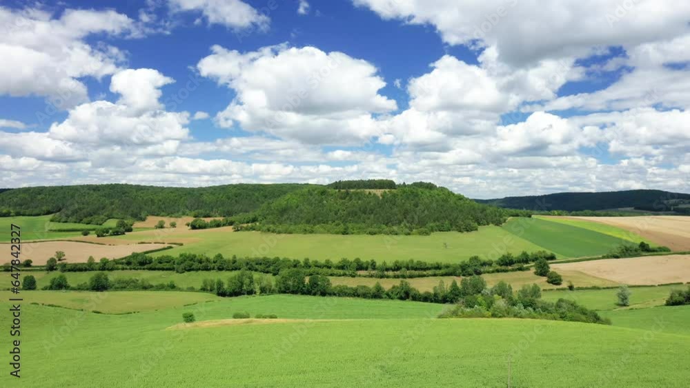 Rural plains with their wooded nature and green fields in Europe, France, Burgundy, Nievre, towards Chateau Chinon, in summer, on a sunny day. Rural plains with their wooded nature and green fields in Europe, France, Burgundy, Nievre, towards Chateau Chinon, in summer, on a sunny day.