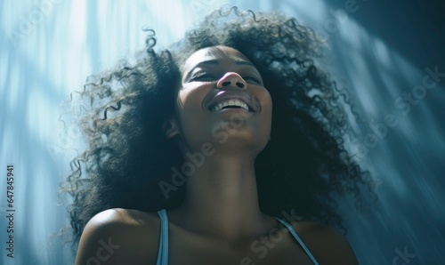 Radiant African American Woman Smiling with Natural Curly Hair - A Portrait of Authentic Joy and Beauty