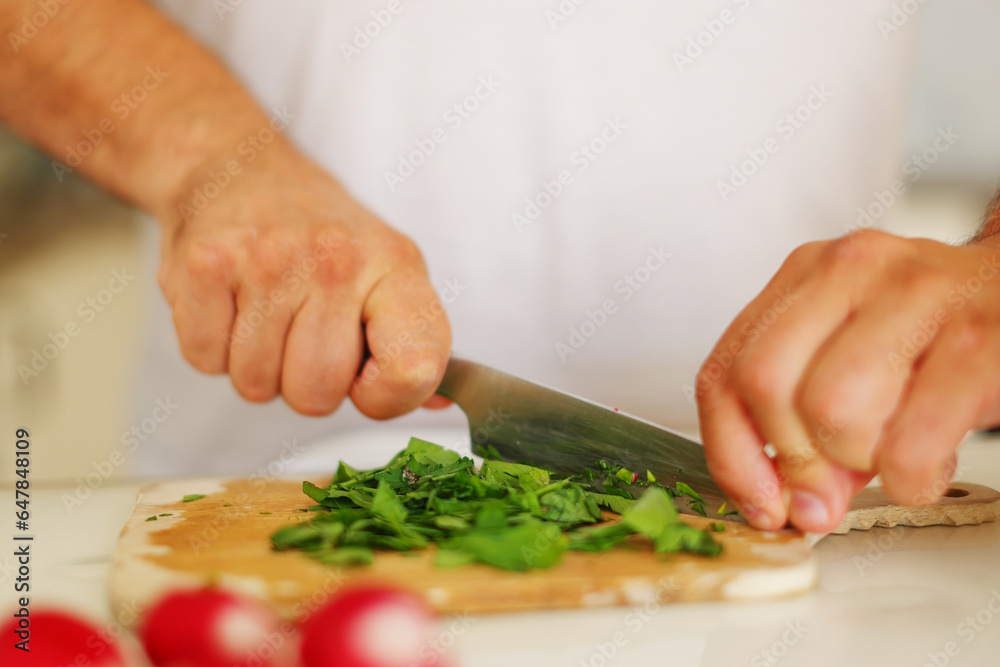 chef man prepare food at home cutting vegetables for soup Kholodnik
