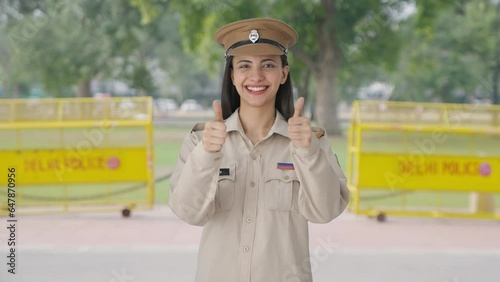 Happy Indian female police officer doing Thumbs up photo