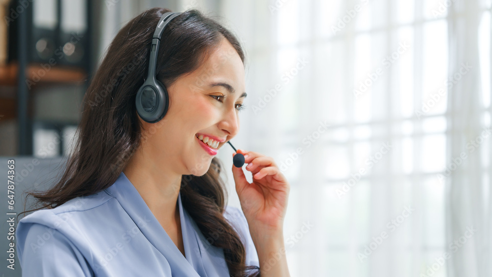 Asian business woman working with trade and finance partnership, investment bankers and institutional investors working closely on trade and finance deals. headphone, call center Asian business woman working with trade and finance partnership, investment bankers and institutional investors working closely on trade and finance deals. headphone, call center