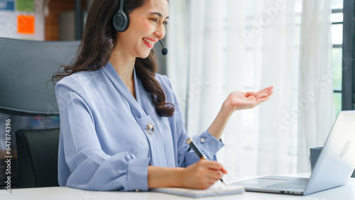 Asian business woman working with trade and finance partnership, investment bankers and institutional investors working closely on trade and finance deals. headphone, call center