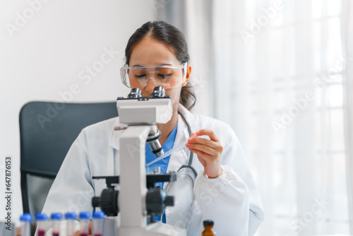 Young scientists pioneering medical discoveries in lab  with one scientist employing microscope for invaluable insights  blood lab test  virus vaccine invent  asian indian people