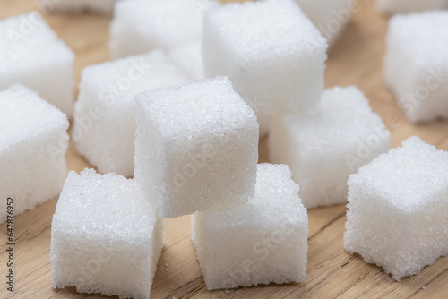 pieces of white refined sugar on the table