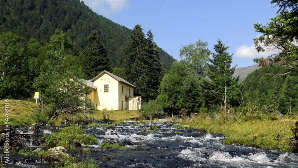 he river Le Lhecou in the heart of the green mountain countryside, in Europe, in France, Occitanie, in the Hautes-Pyrenees, in summer, on a sunny day. he river Le Lhecou in the heart of the green mountain countryside, in Europe, in France, Occitanie, in the Hautes-Pyrenees, in summer, on a sunny day.