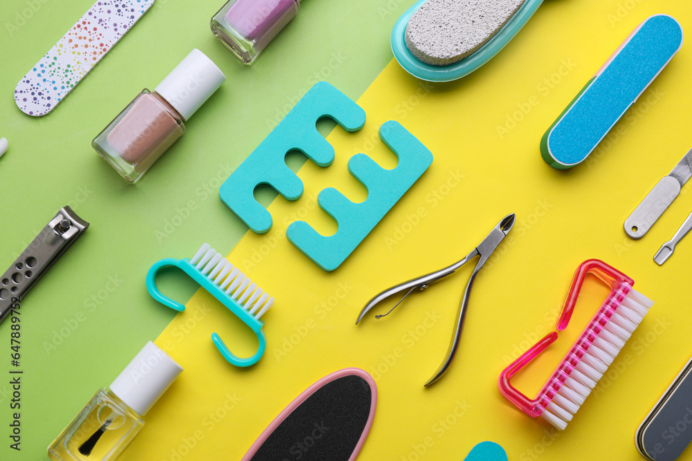 Set of pedicure tools on color background, flat lay Set of pedicure tools on color background, flat lay