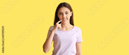 Pretty girl pointing at den...