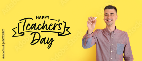 Male teacher with chalk on ...