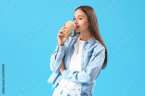 Young woman drinking coffee...