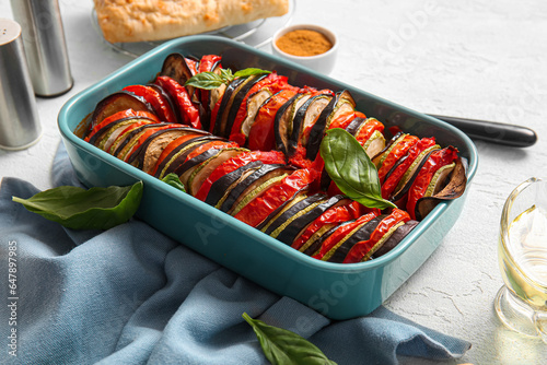 Baking dish of tasty Ratatouille on white background