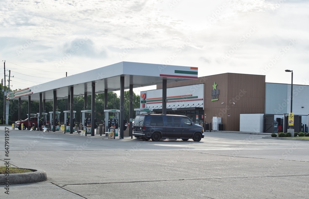 7Eleven gas station and pumps with a Laredo Taco store in Houston, TX