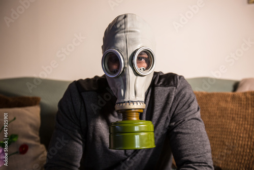 Civilian wearing nuclear gas mask during nuclear fallout and a time of war photo