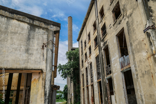 Abandoned factory with giant chimney