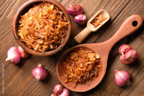 fried shallots in an earthenware bowl. Indonesian food. food sprinkles. bawang merah goreng.