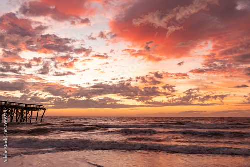 Sunrise over the pawley's island fishing pier showing hurricane damage photo