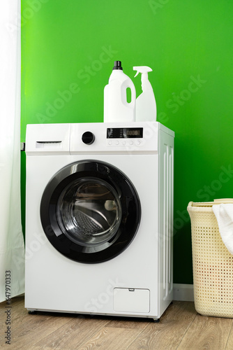 Laundry washing detergents containers on washing machine