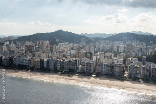 Beautiful aerial view to ocean beach and city buildings in Rio