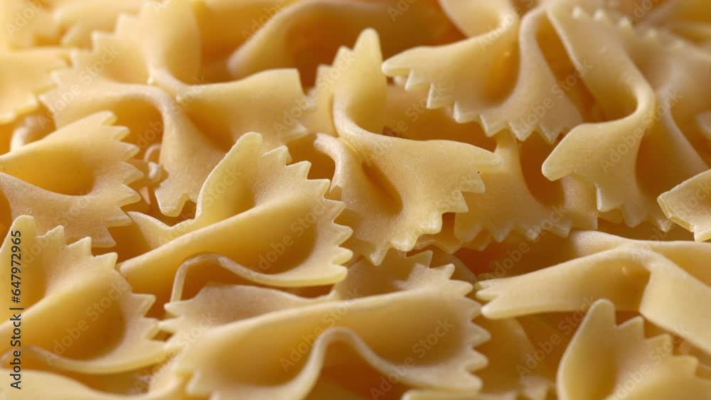 Close-up video of dried pasta. Farfalle. rotation. Close-up video of dried pasta. Farfalle. rotation.