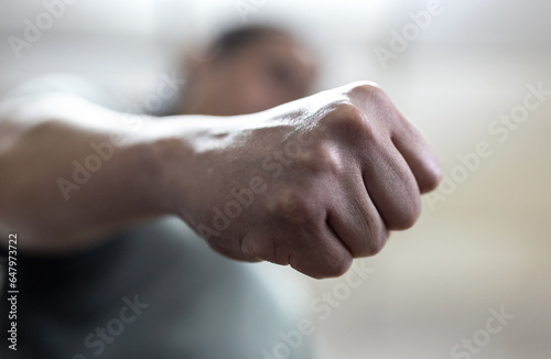The angry man clenched his fist. Concept of violence.