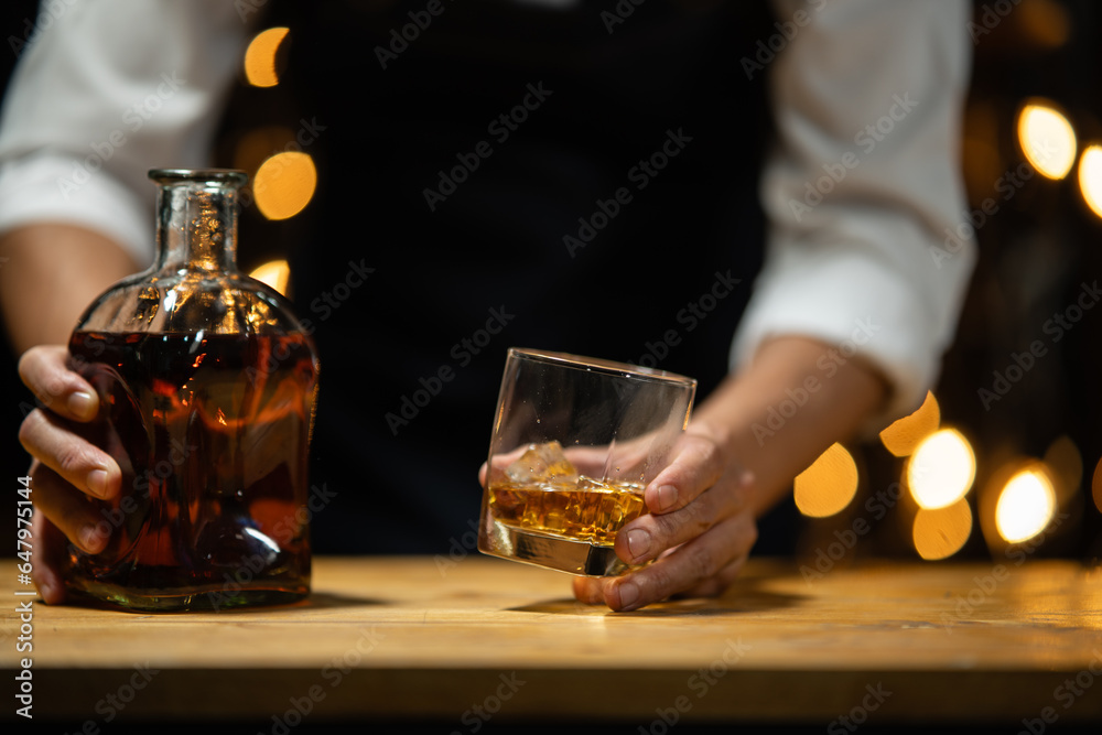 Barman pouring whiskey whiskey glass beautiful night