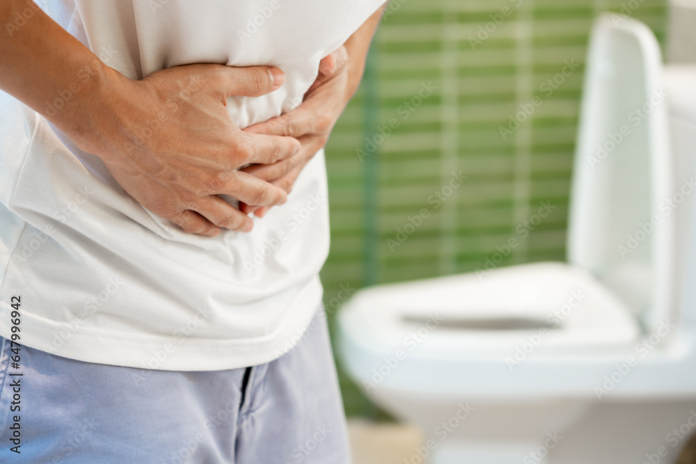 Constipation and diarrhea in bathroom. Hurt man touch belly stomach
