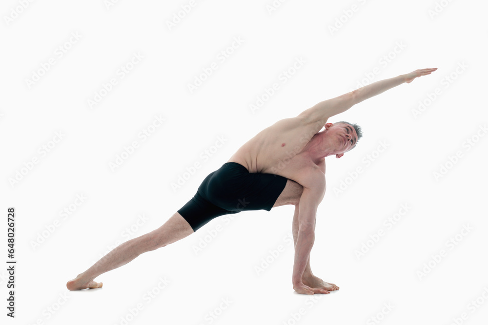 Utthita Parsvakonasana (Extended Side Angle Pose), Ashtanga yoga Side view of man wearing sportswear doing Yoga exercise against white background. Utthita Parsvakonasana (Extended Side Angle Pose), Ashtanga yoga Side view of man wearing sportswear doing Yoga exercise against white background.
