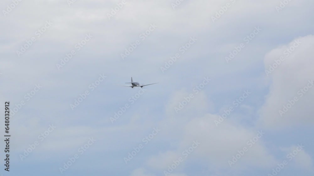 Silver and Blue Douglas DC3 performs at Baltic International Airshow, carrying out flypast, view from the ground, handheld 4k shot Silver and Blue Douglas DC3 performs at Baltic International Airshow, carrying out flypast, view from the ground, handheld 4k shot