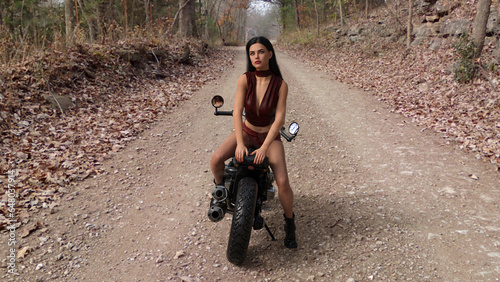 Beautiful brunette girl in red leather outfit with motocycle 3D illustration