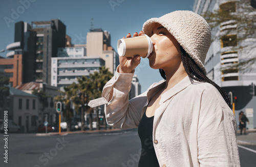 Coffee, travel and woman drink in city with trendy clothes for commute, walking and adventure. Relax, student and person with beverage, drinking and tea in town street for holiday, break and weekend