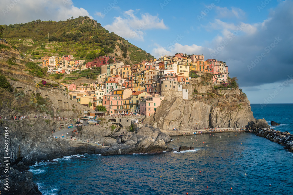 Manarola beach and colorful architecture on cliff, famous Cinque Terre commune, ITALY
