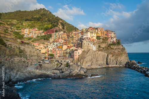 Manarola beach and colorful architecture on cliff, famous Cinque Terre commune, ITALY