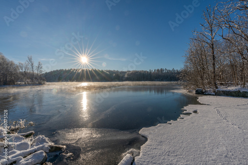 Beautiful winter view from a frozen lake in Sweden