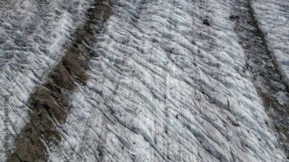 The surface of a glacier. Moraines and glacial crevasses. Aerial Shot The surface of a glacier. Moraines and glacial crevasses. Aerial Shot