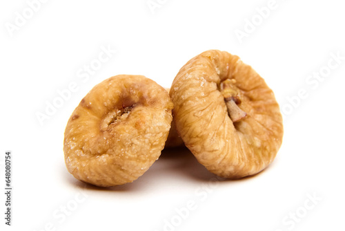 Dried fig fruits isolated on white. Three sweet sundried figs