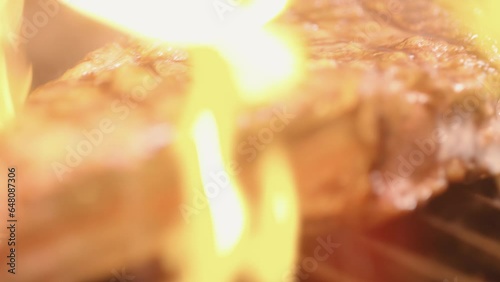 Flames over a piece of meat photo