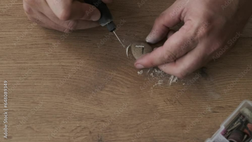 a man carves runes out of stone a man carves runes out of stone