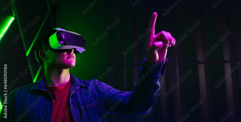 Gaming in virtual reality: Man playing with objects in the digital world Gaming in virtual reality: Man playing with objects in the digital world