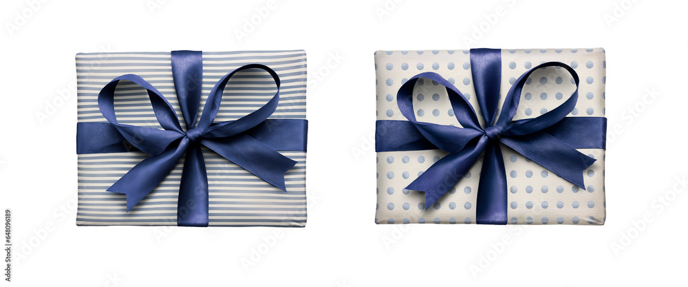 Top view of Christmas, birthday or valentine presents decorated in pale blue spots and stripes with a blue ribbon bow isolated against a transparent background.