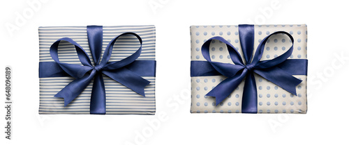 Obraz na płótnie Top view of Christmas, birthday or valentine presents decorated in pale blue spots and stripes with a blue ribbon bow isolated against a transparent background. w salonie