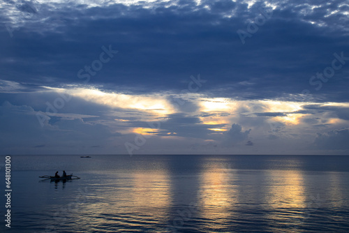 Sunrise with fisherman in Maria Siquijor Philippines.