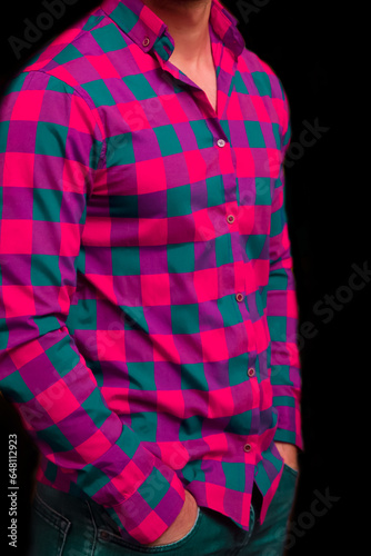 Men's business style clothing and fashion pink shirt with a large check blue pattern on a dark background